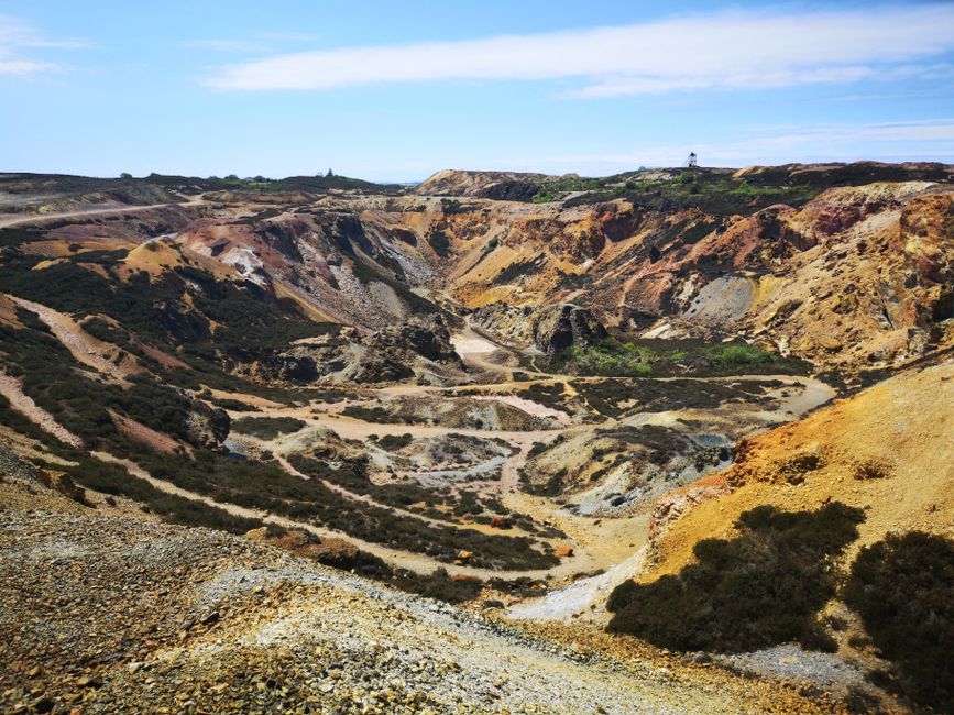 Vibrant aerial view of Parys Mountain's historic copper mine in Wales showcasing rugged geological formations.